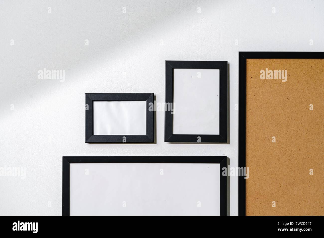 Set of black frames on white wall with copy space Stock Photo
