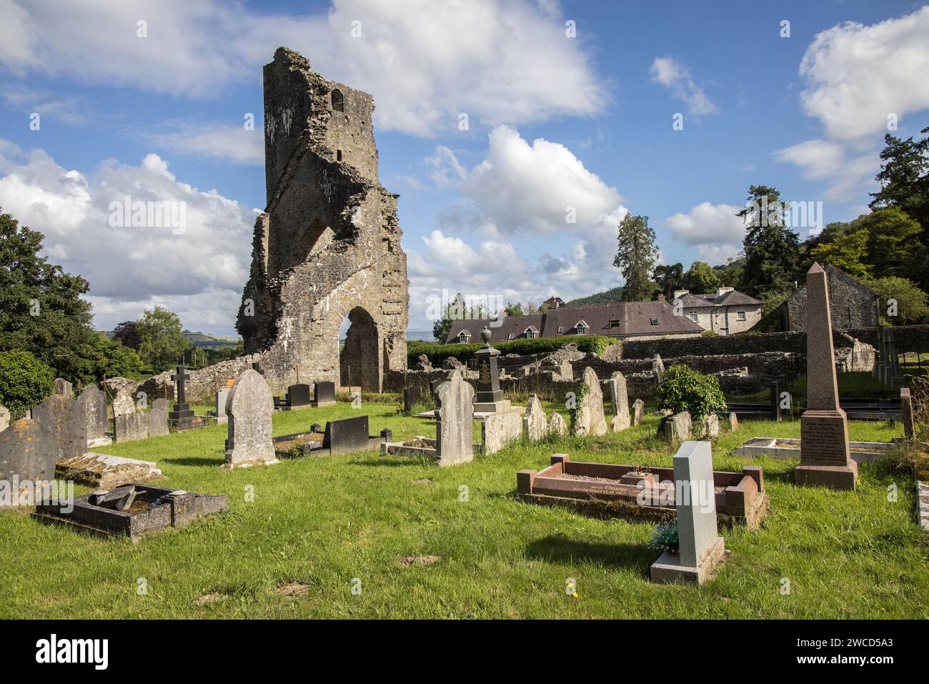 Talley Abbey ruin and graves in churchyard, Llandovery, Wales, UK Stock Photo