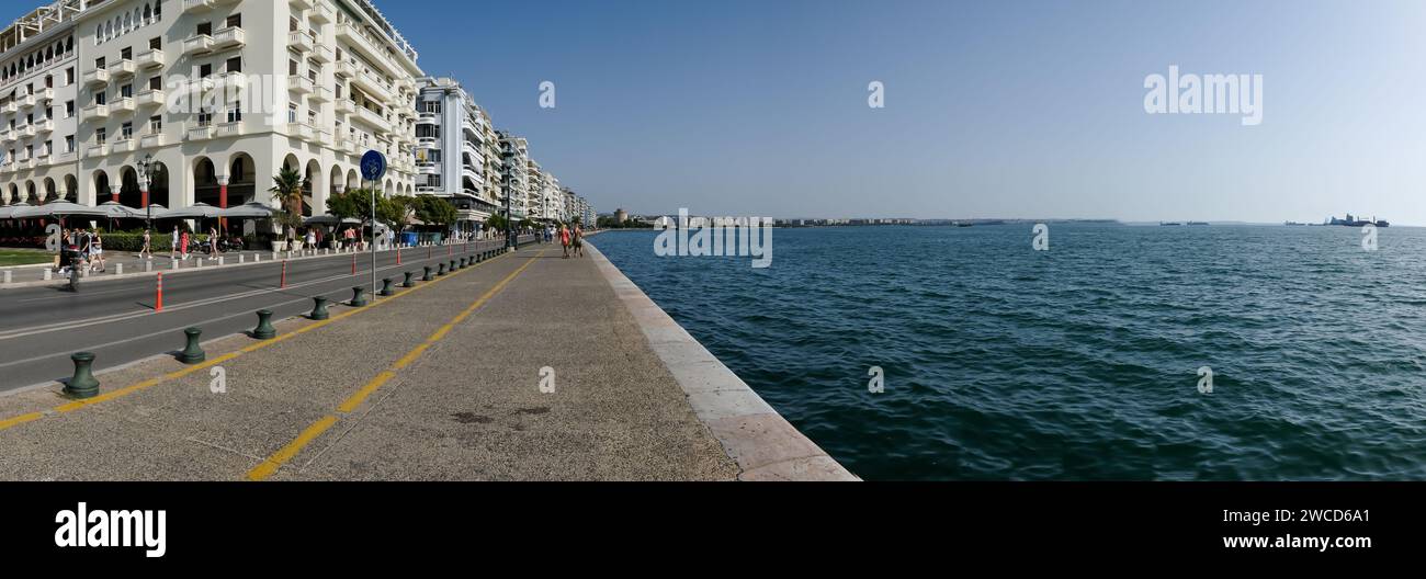Thessaloniki, Greece - September 22, 2023 : View of the famous Paralia, the popular beach promenade and the famous White Tower in Thessaloniki Stock Photo
