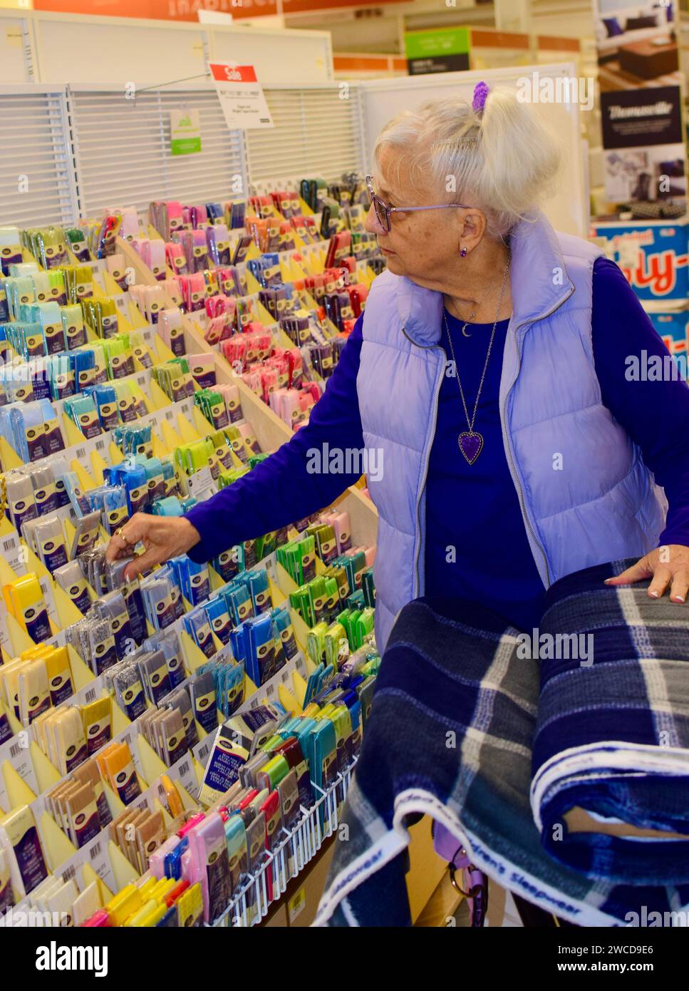 Store Lady Senior lady shopping fabric storeModel Release Stock Photo - Alamy