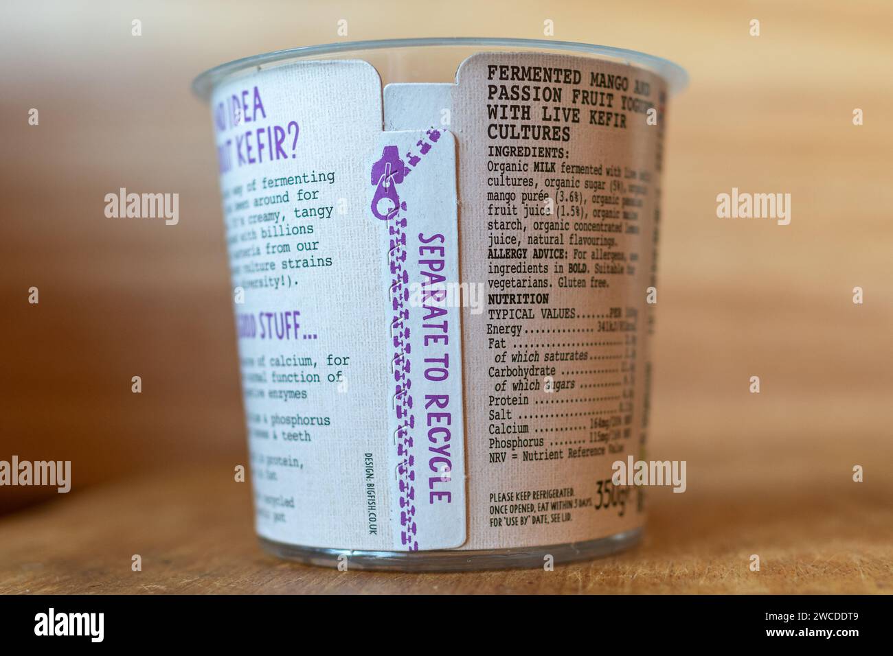 New recyclable packaging on kefir yoghurt pot with two layers, instruction separate to recycle, to reduce plastic waste going to landfill Stock Photo