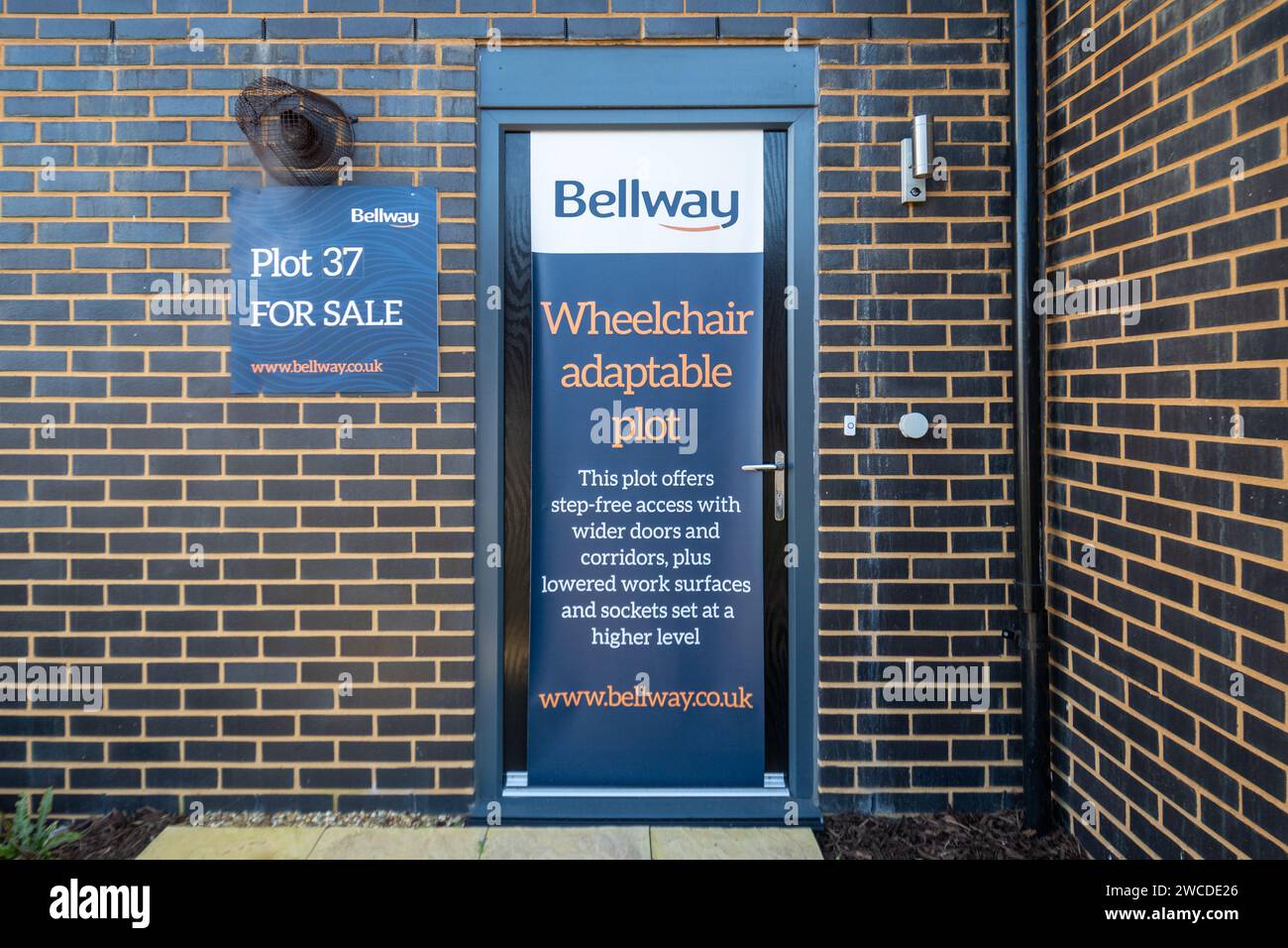 Wheelchair adaptable plot advertised by Bellway Homes developer on a ground floor flat or apartment in a new development, England, UK Stock Photo