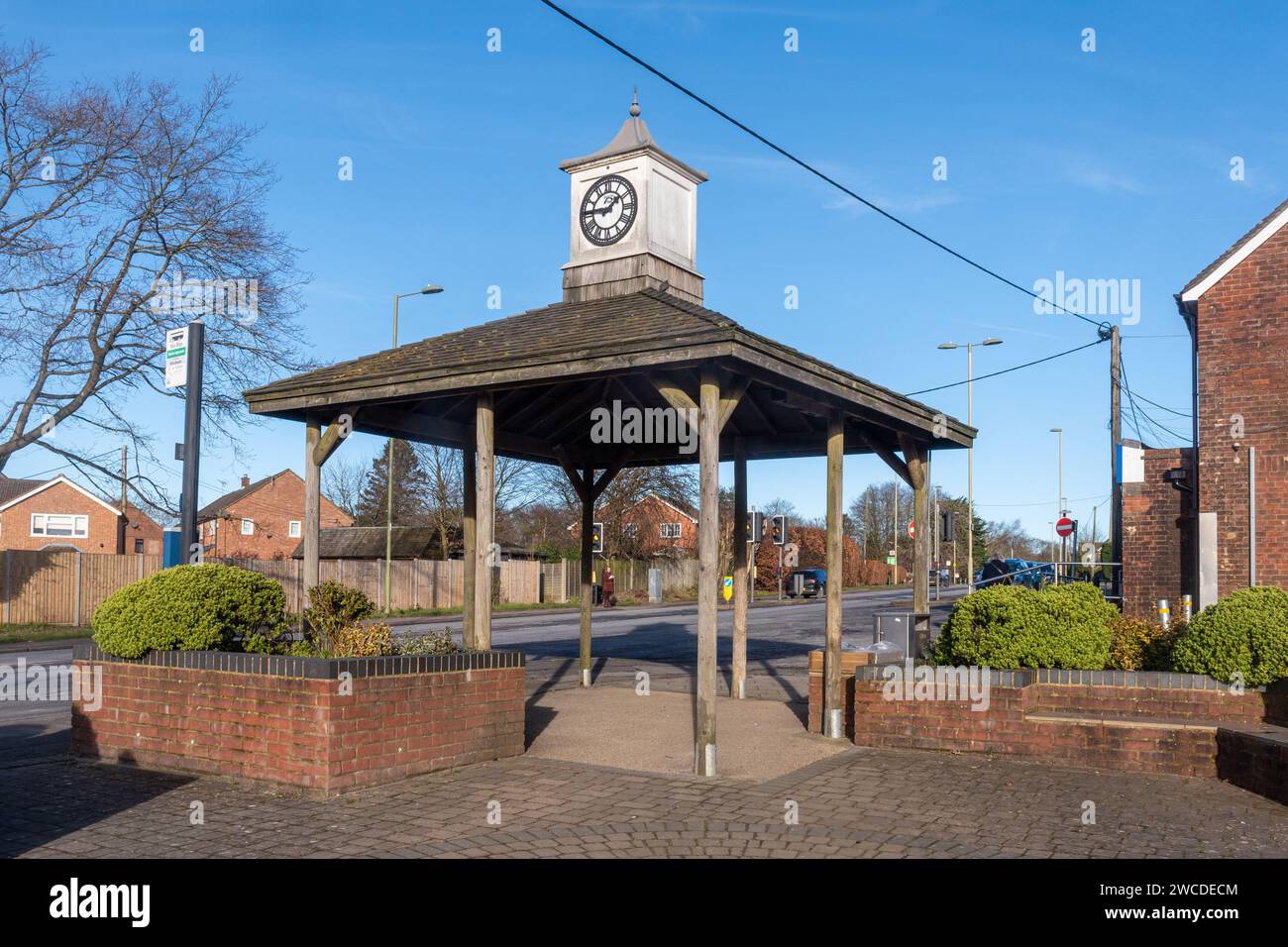 Village clock and bus shelter in Four Marks village centre, Hampshire