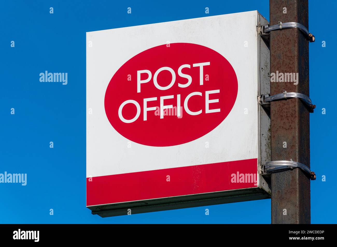 Post Office sign and logo against blue sky, Hampshire, England, UK, January 2024 Stock Photo Alamy