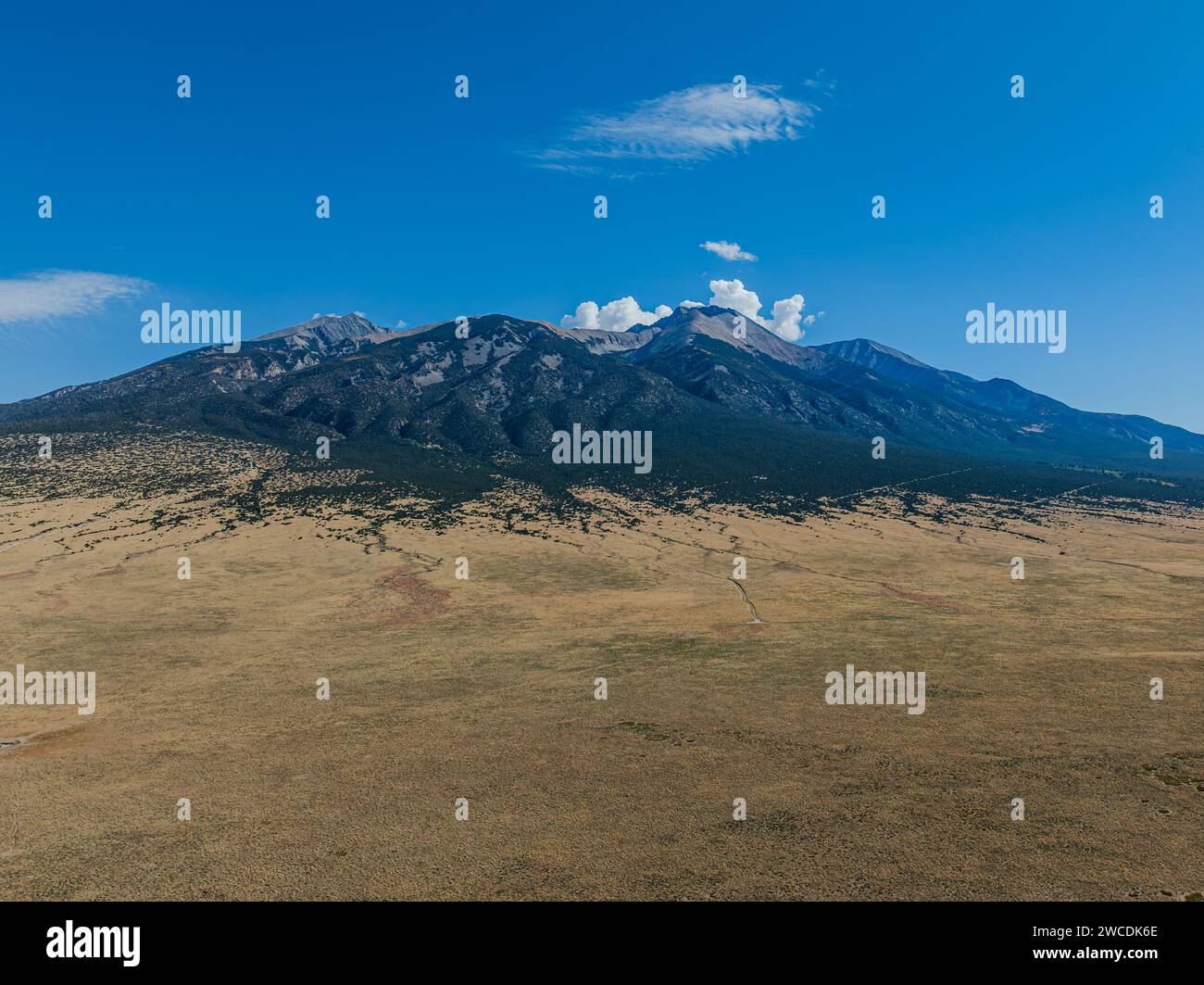 Vast plains stretch towards the imposing mountains under the Colorado sky Stock Photo Alamy