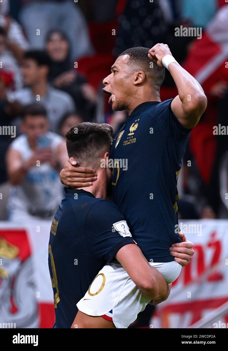 Kylian Mbappé celebrates with Olivier Giroud after France's first goal vs Poland in the 44th minute of the 2022 FIFA World Cup Round of 16 in Qatar. Stock Photo