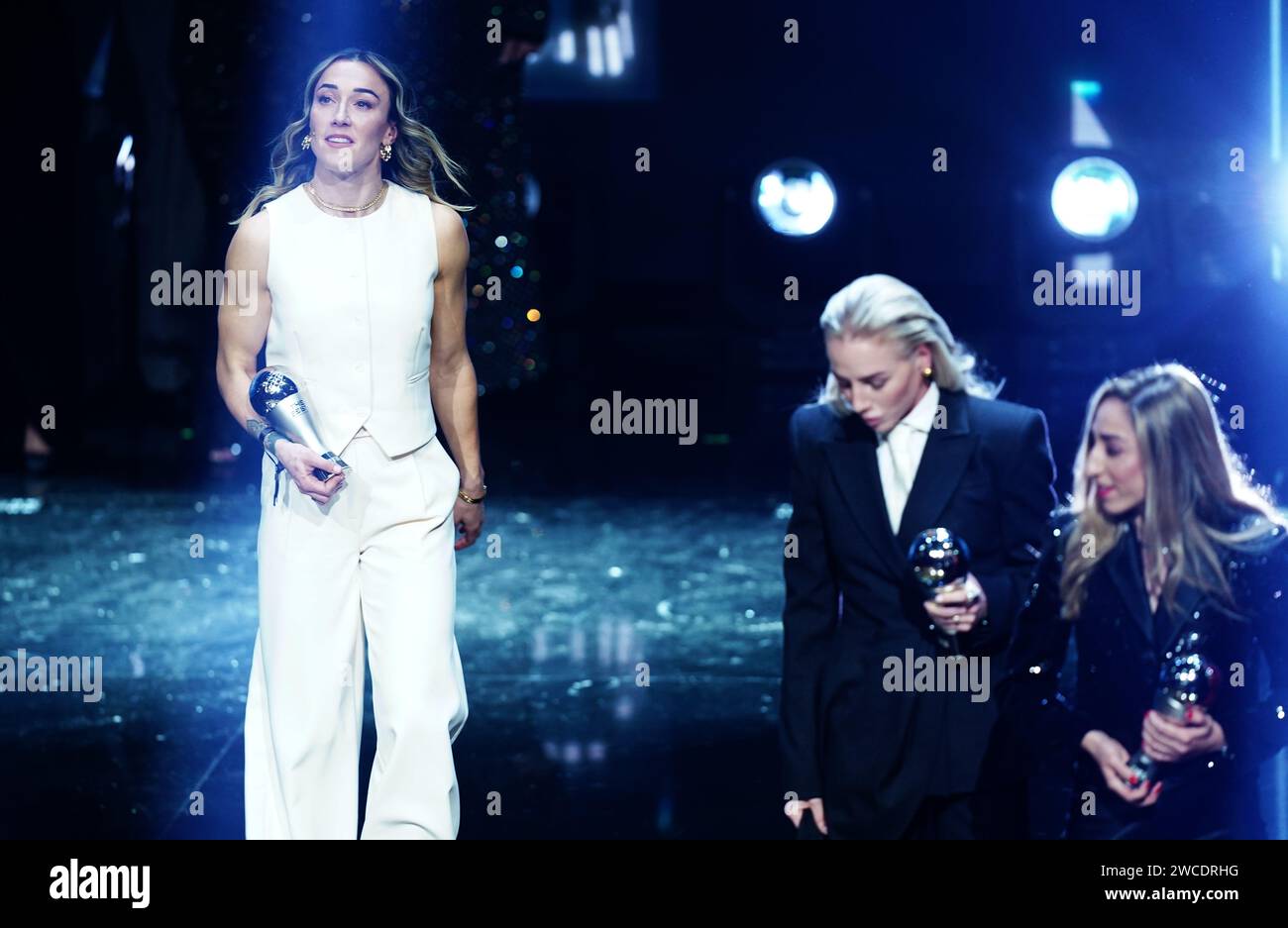 Lucy Bronze (left) on stage after receiving an award for being part of