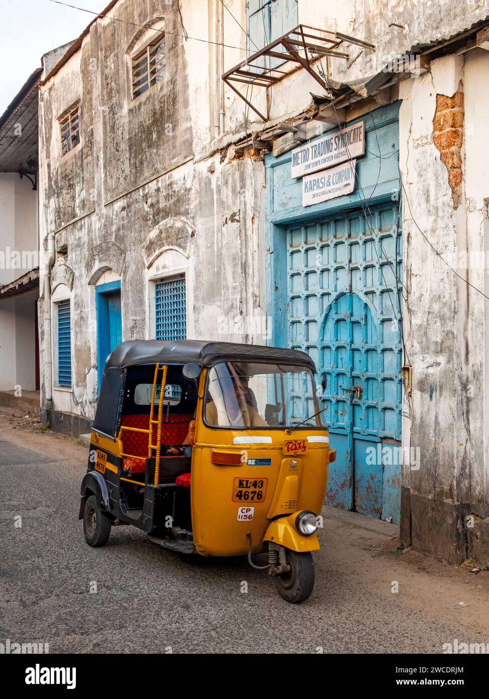 Street scene with yellow auto-rickshaw, Matancherry, Jew Town, Cochin, Kerala, India Stock Photo