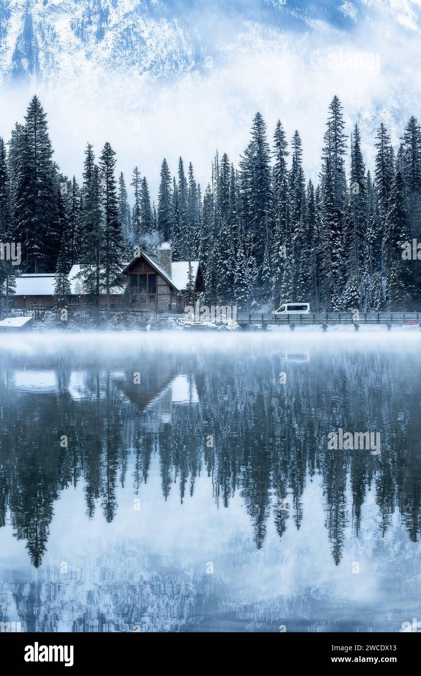 A fine art landscape photography image of moody and atmospheric conditions at Emerald Lake Lodge after a fresh Winter snowfall. Stock Photo