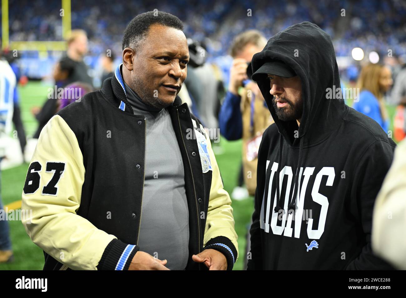 DETROIT, MI - JANUARY 14: Former Detroit Lions star Barry Sanders and Eminem talk football before the game between Los Angeles Rams and Detroit Lions on January 14, 2024 at Ford Field in Detroit, MI (Photo by Allan Dranberg/CSM) (Credit Image: © Allan Dranberg/Cal Sport Media) Stock Photo