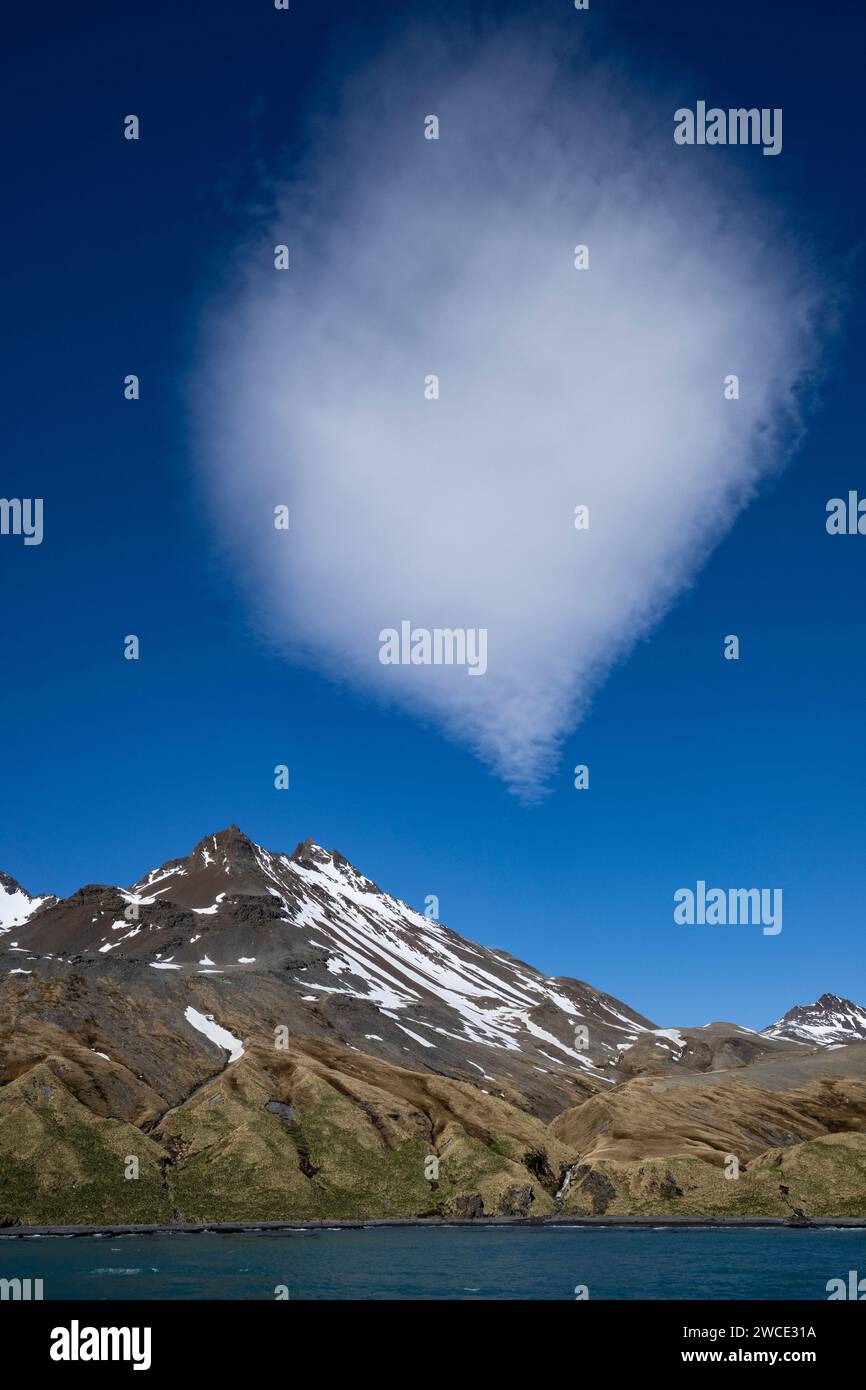 Rosita Harbor cloud sitting on mountain peak, stacked lenticular formation unusual and beautiful, constantly changing Stock Photo