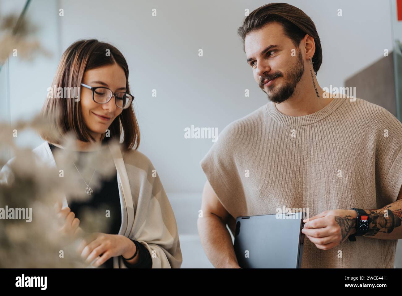 Young professionals collaborating in a modern office, analyzing ...