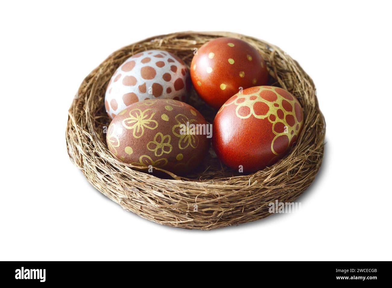 Easter eggs in nest isolated on white background Stock Photo