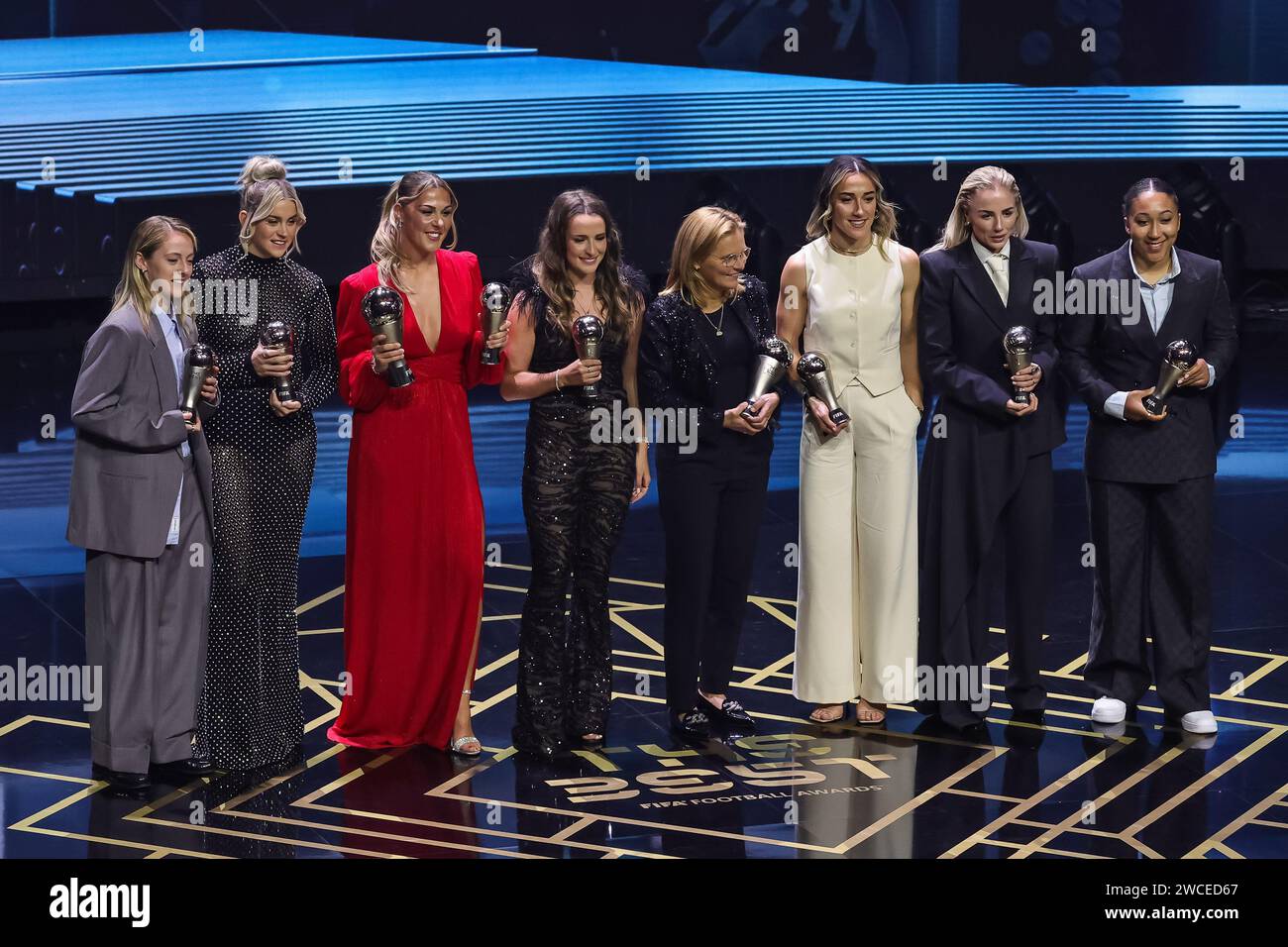 Keira Walsh, Alessia Russo, Mary Earps, Ella Toone, Lucy Bronze, Alex Greenwood, Lauren James, Members of the Fifpro Women's World XI and FIFA Women's Coach of the Year, Sarina Wiegman, pose for a photograph on stage with their trophies during The Best FIFA Football Awards 2023 at Eventim Apollo, London, United Kingdom, 15th January 2024 (Photo by Mark Cosgrove/News Images) Credit: News Images LTD/Alamy Live News Stock Photo
