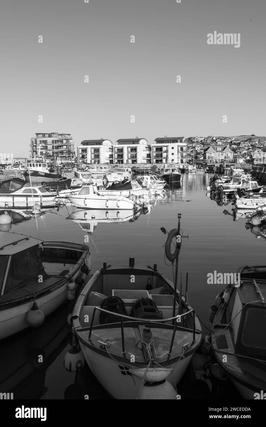 Fishing boats moored in West Bay harbour in Dorset Stock Photo - Alamy