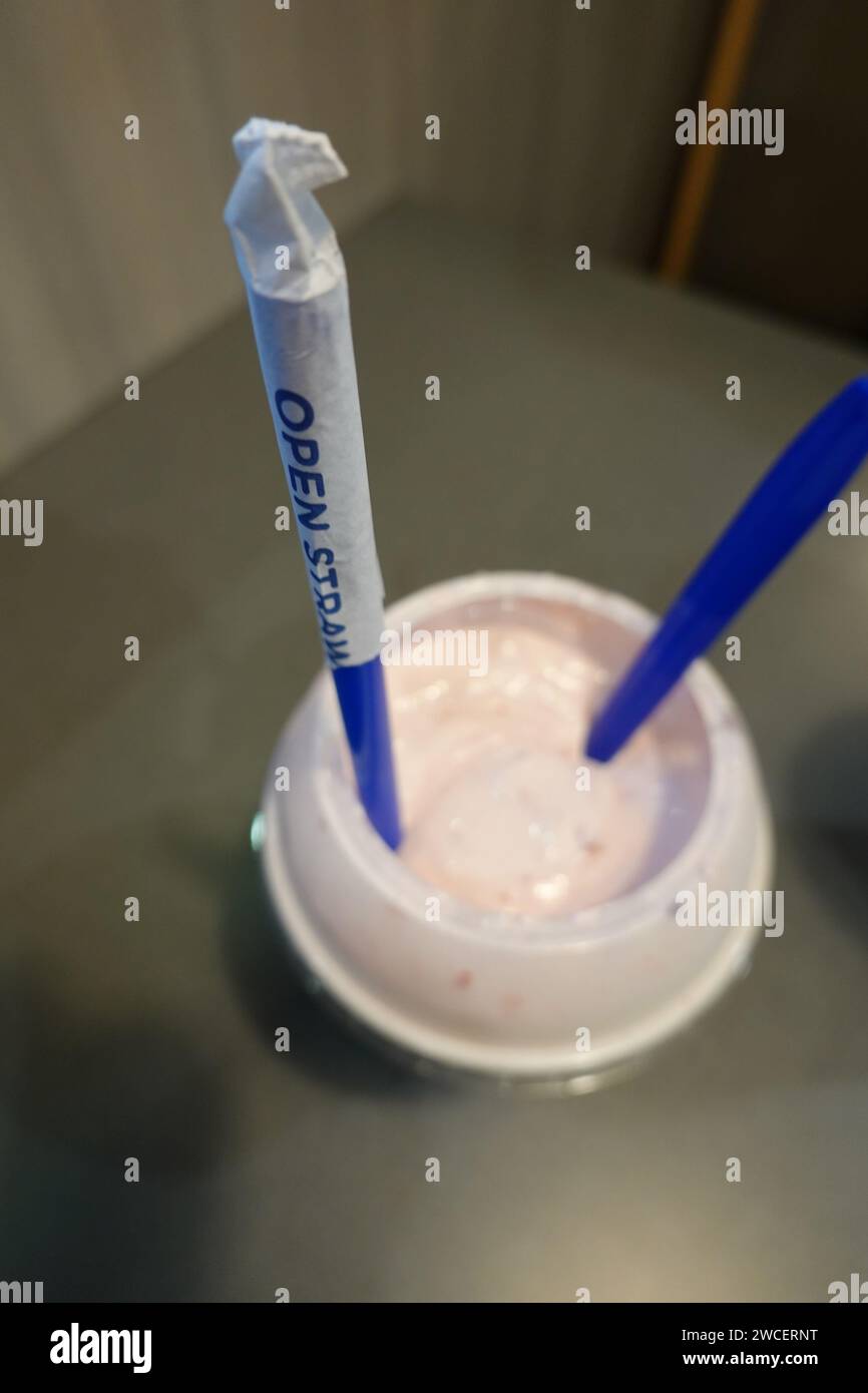Straw and spoon in a strawberry shake at Culver's Restaurant November