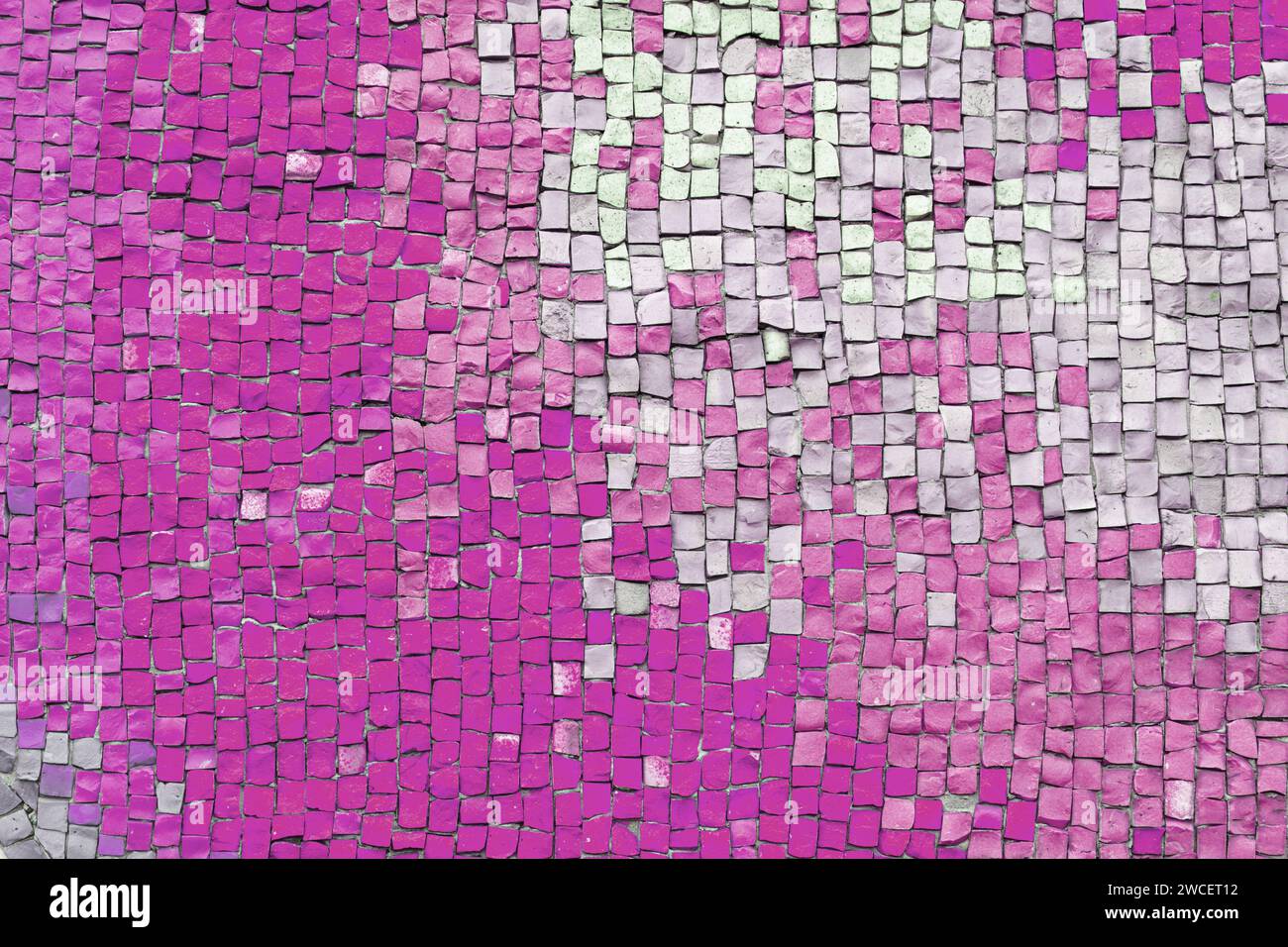 Abstract mosaic ceramic tile background. Chaotic pattern of pink and white ceramic tiles, wall decor, interior design element. Wallpaper, backdrop, co Stock Photo