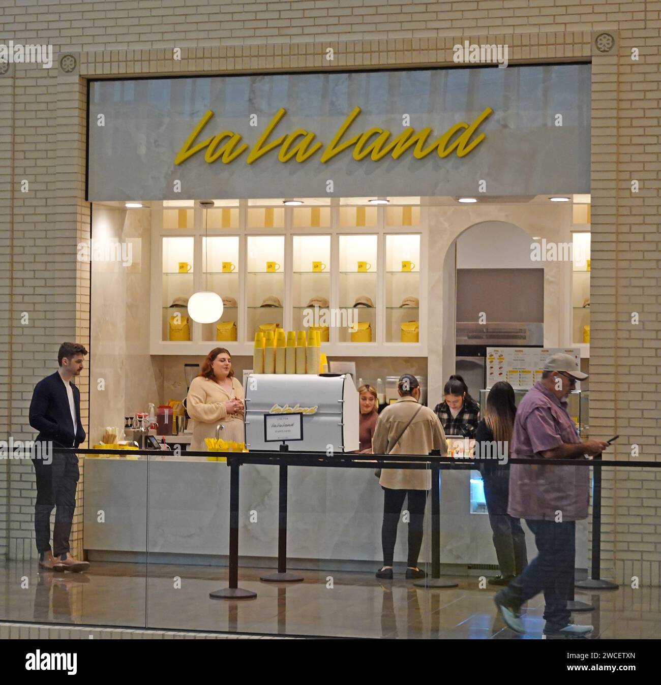 Customers waiting at a LaLaLand cafe in Northpark Center shopping mall - November 2023 Stock Photo