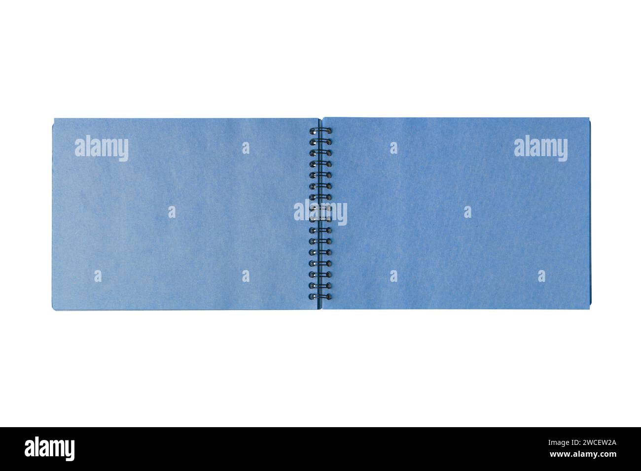 Open spiral bound notepad with two craft blue sheets, isolated on white