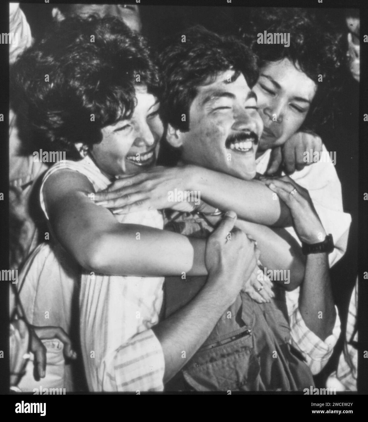 Political prisoners celebrate their release by newly installed President Corazon Aquino. Days earlier, Philippines dictator Ferdinand Marcos was overthrown by the People Power revolution in February 1986. Stock Photo