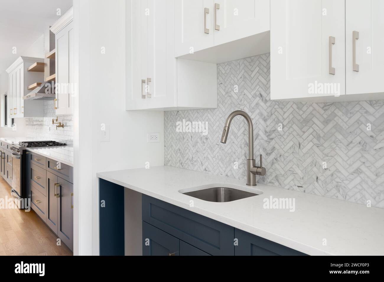 A scullery or butler's pantry detail with a bronze faucet and hardware