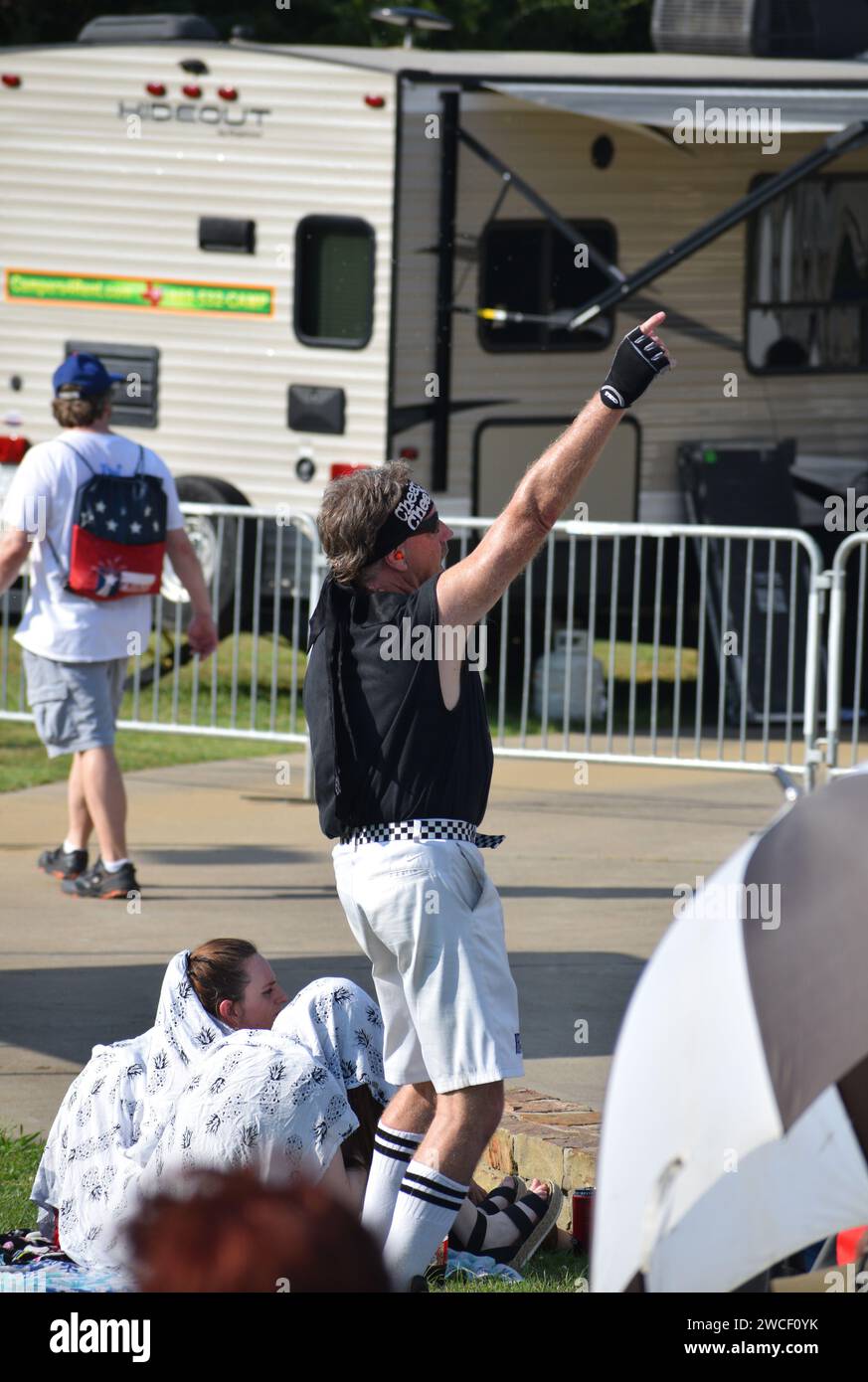 A very enthusaistic Cheap Trick fan dances before Cheap Trick plays a concert in Sherman Texas July 3, 2023 Stock Photo