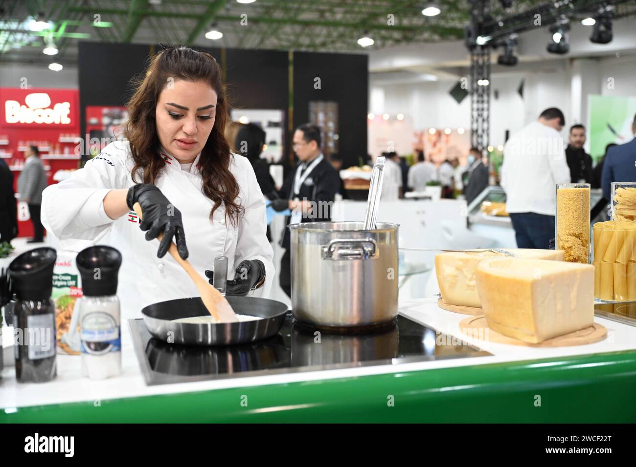 Hawalli, Kuwait. 15th Jan, 2024. An exhibitor prepares food during the ...