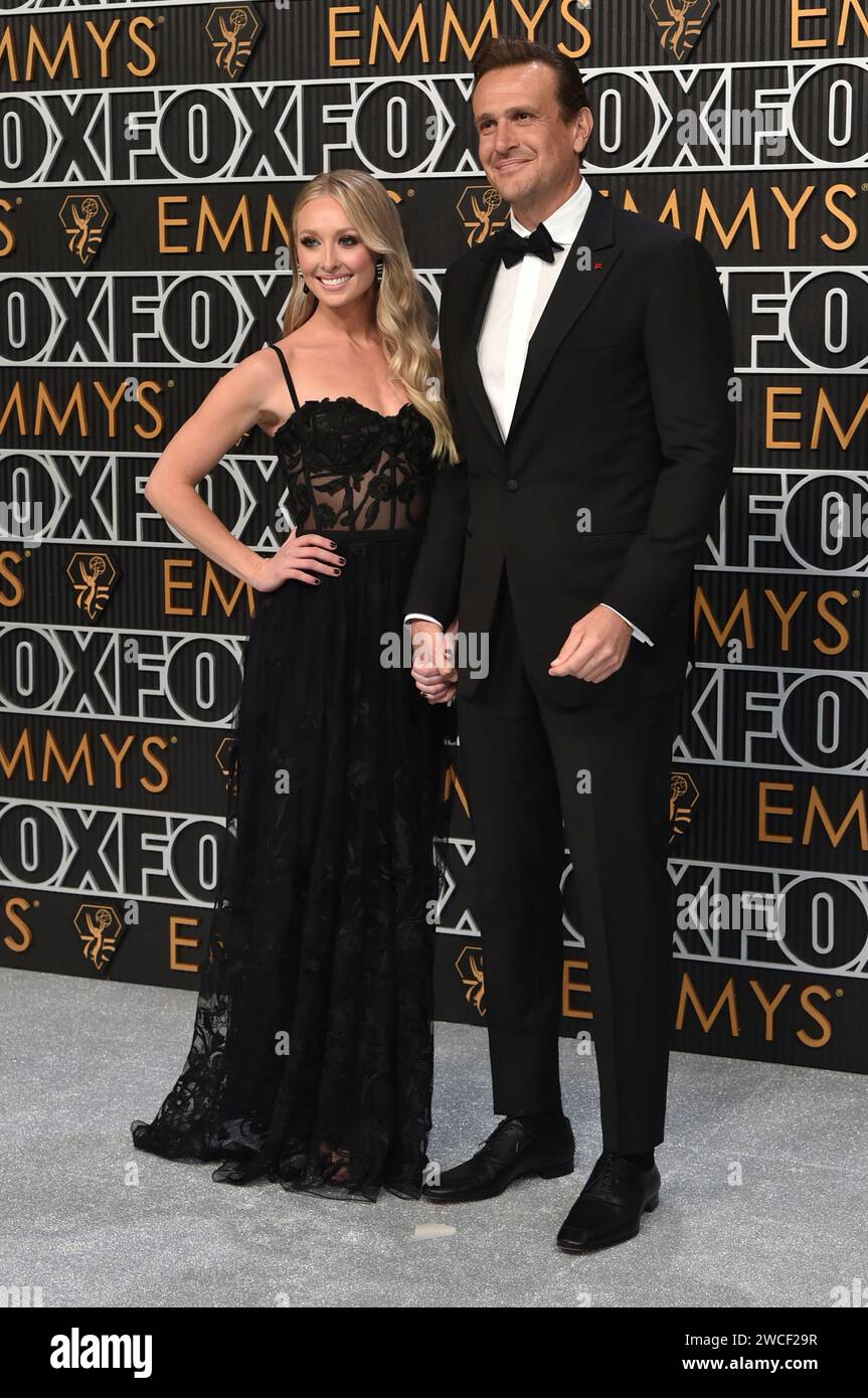 Kayla Radomski, left, and Jason Segel arrive at the 75th Primetime Emmy
