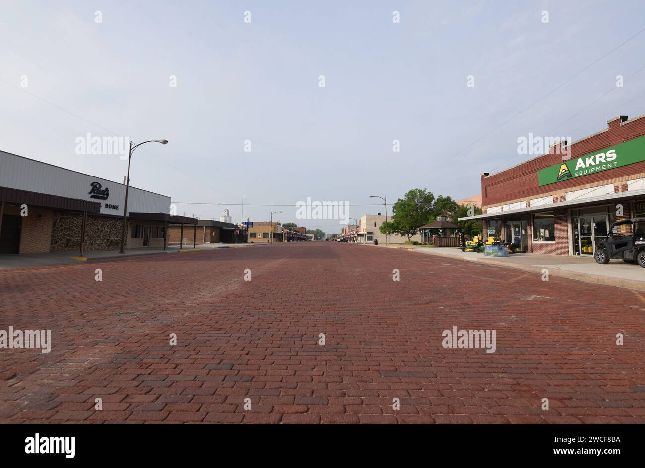 Large brick paved road in downtown Oberlin Kansas, Akers Equipment on