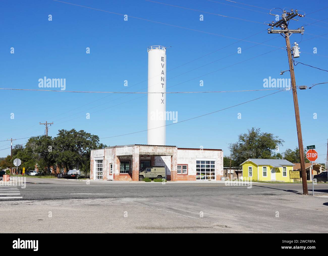 An abandoned gas station in Evant Texas with a small municipal water