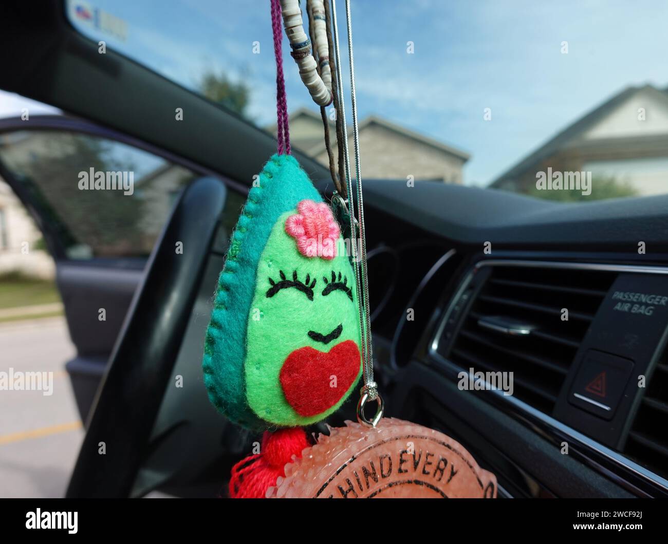 Hanging from the rear view mirror hi-res stock photography and