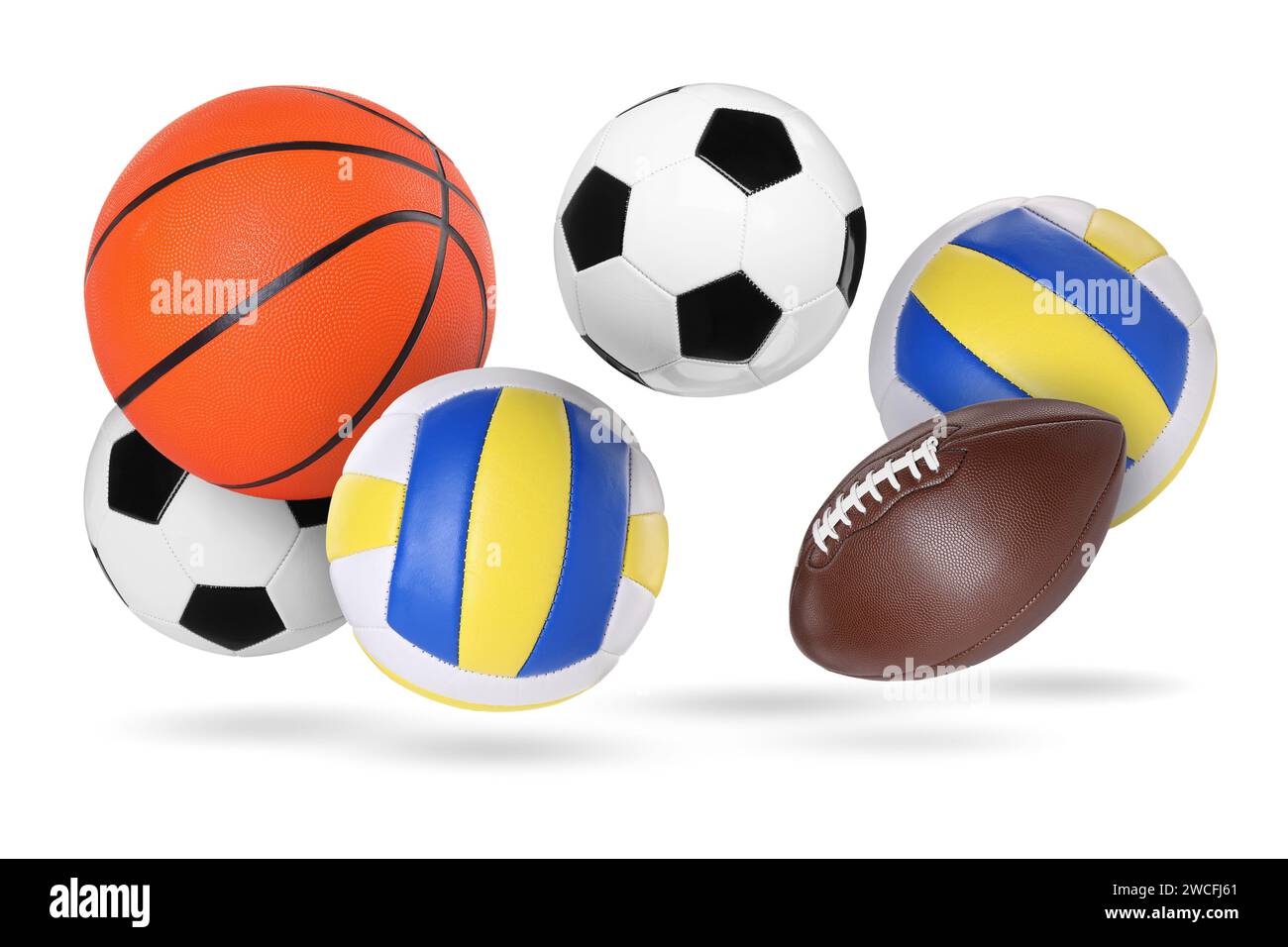 Many balls for different sports flying on white background Stock Photo