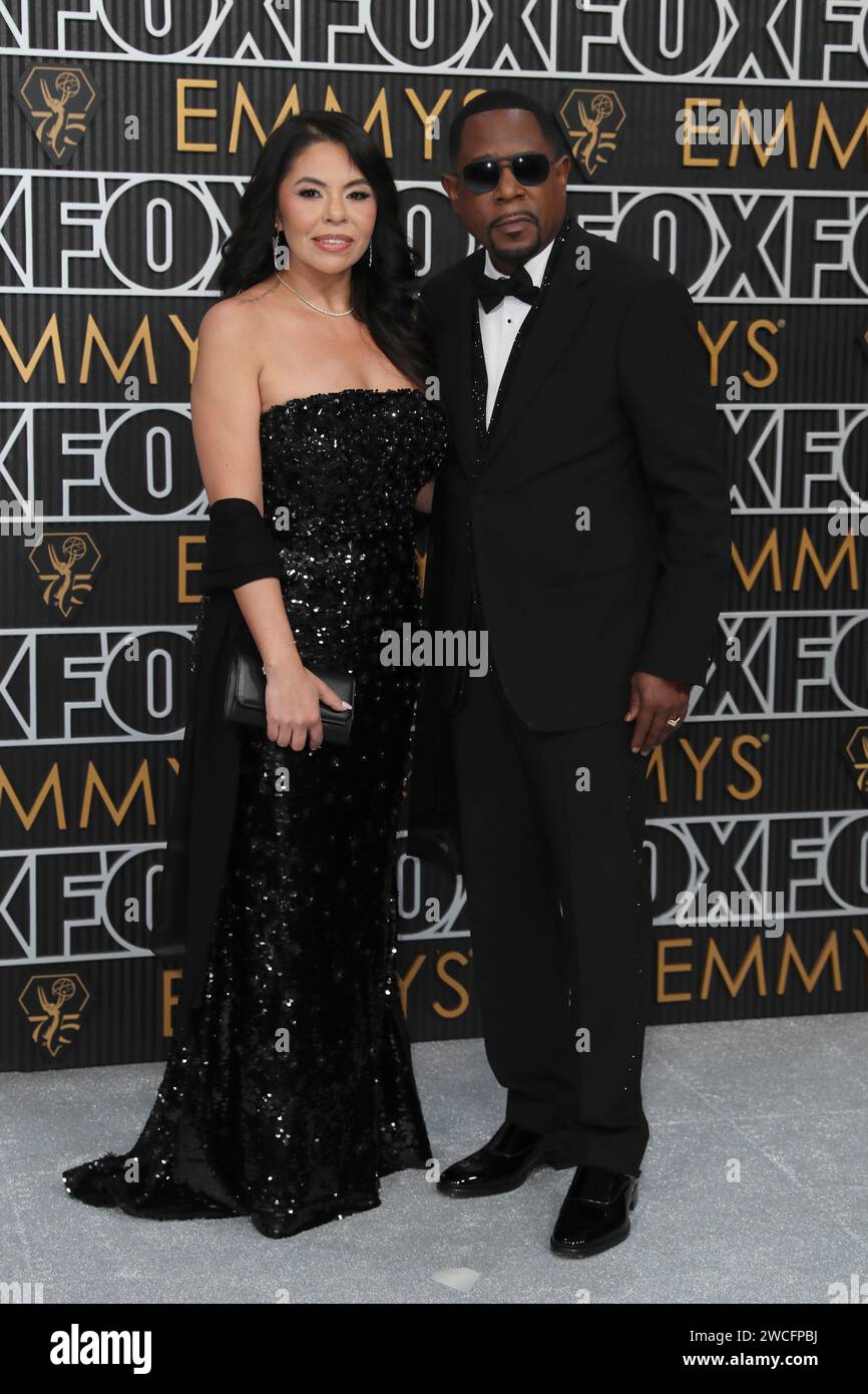 Angie Gonzales, left, and Martin Lawrence pose for a Red Carpet(00)