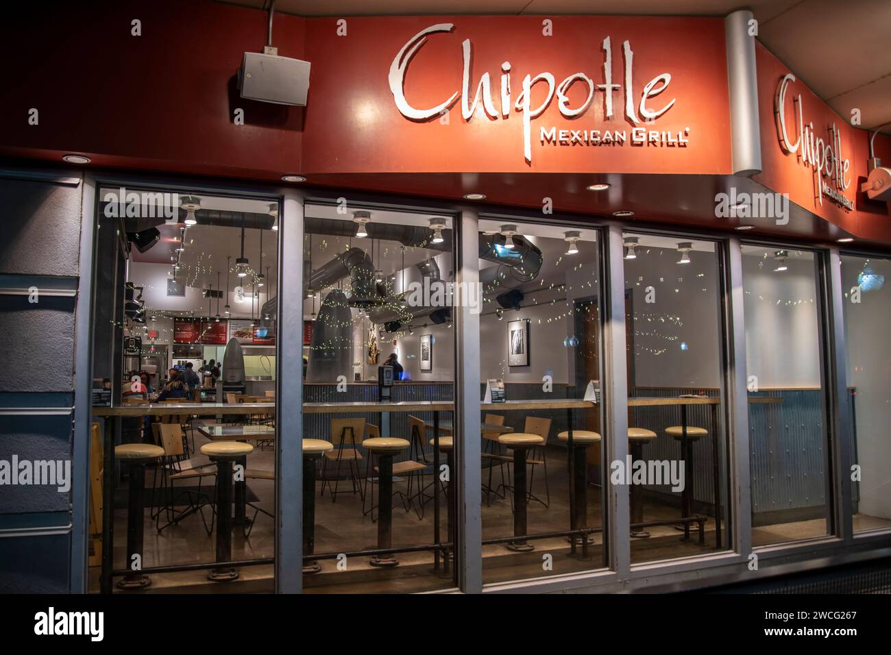 Lawrence, Kansas. Chipotle Mexican Grill on main street at night in downtown Lawrence. Stock Photo