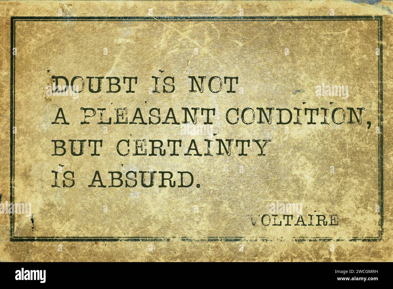 Doubt is not a pleasant condition - ancient French philosopher and writer Voltaire quote printed on grunge vintage cardboard Stock Photo