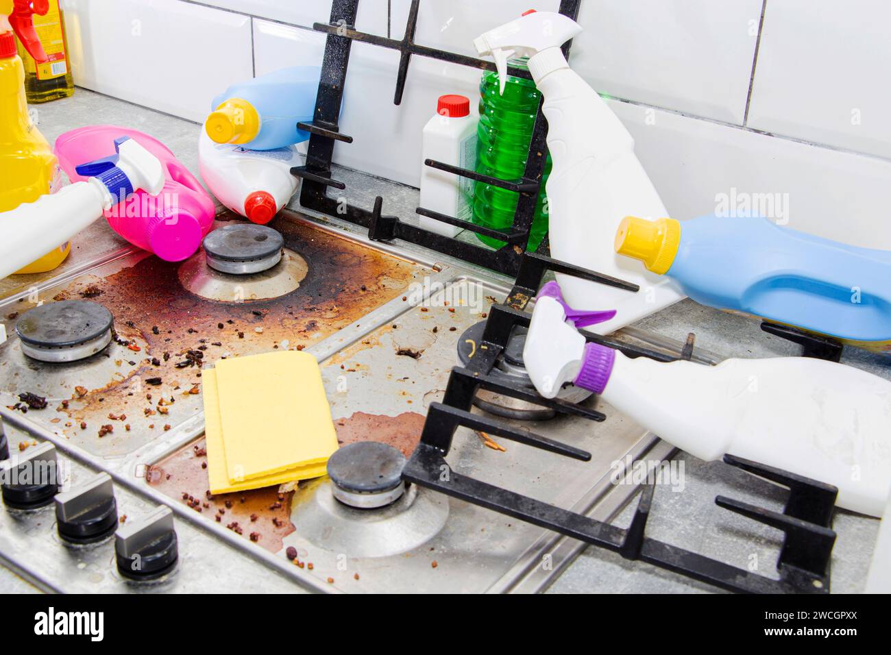 Dirty, top of the gas stove with bits of food. House cleaning Stock Photo