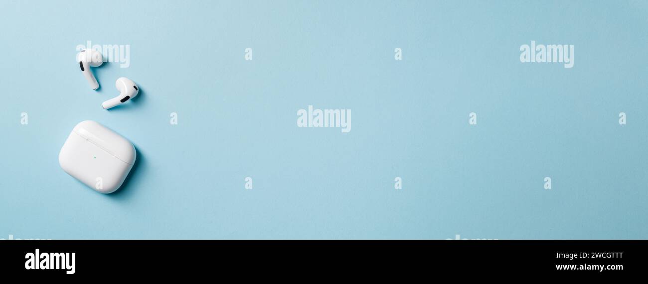 Wireless headphones and charging box, photographed leaving empty space