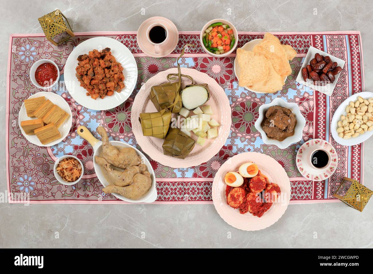 Top View Ketupat Lebaran Menu, Indonesian Celebratory Dish of Rice Cake with Various Side Dishes, Popular Served During Eid Celebrations. Stock Photo