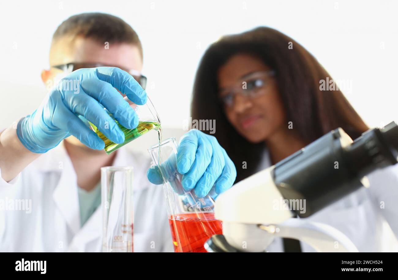 Two Experiments Two researchers are conducting experiments with chemical liquid in ...