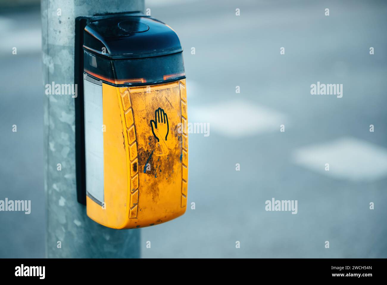 Dirty old traffic light push button on pedestrian crossing, selective focus Stock Photo