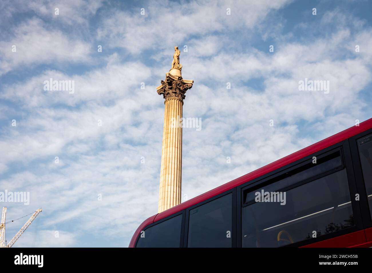 London, 07th October 2023: A red double-decker bus is passing Trafalgar Square in Westminster. Stock Photo