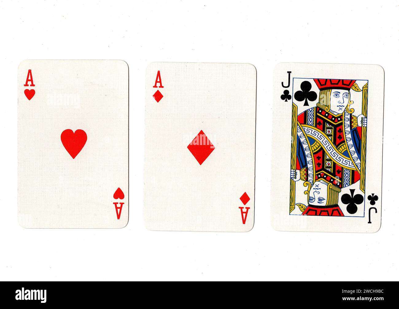 Vintage playing cards showing a pair of aces and a black jack isolated