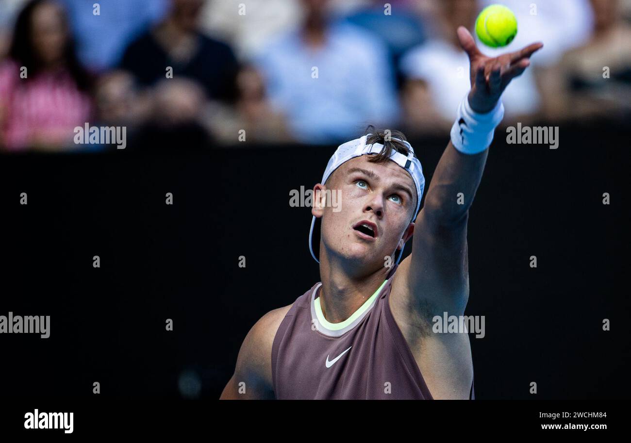 Melbourne, Australia. 16th Jan, 2024. Holger Rune of Denmark serves ...