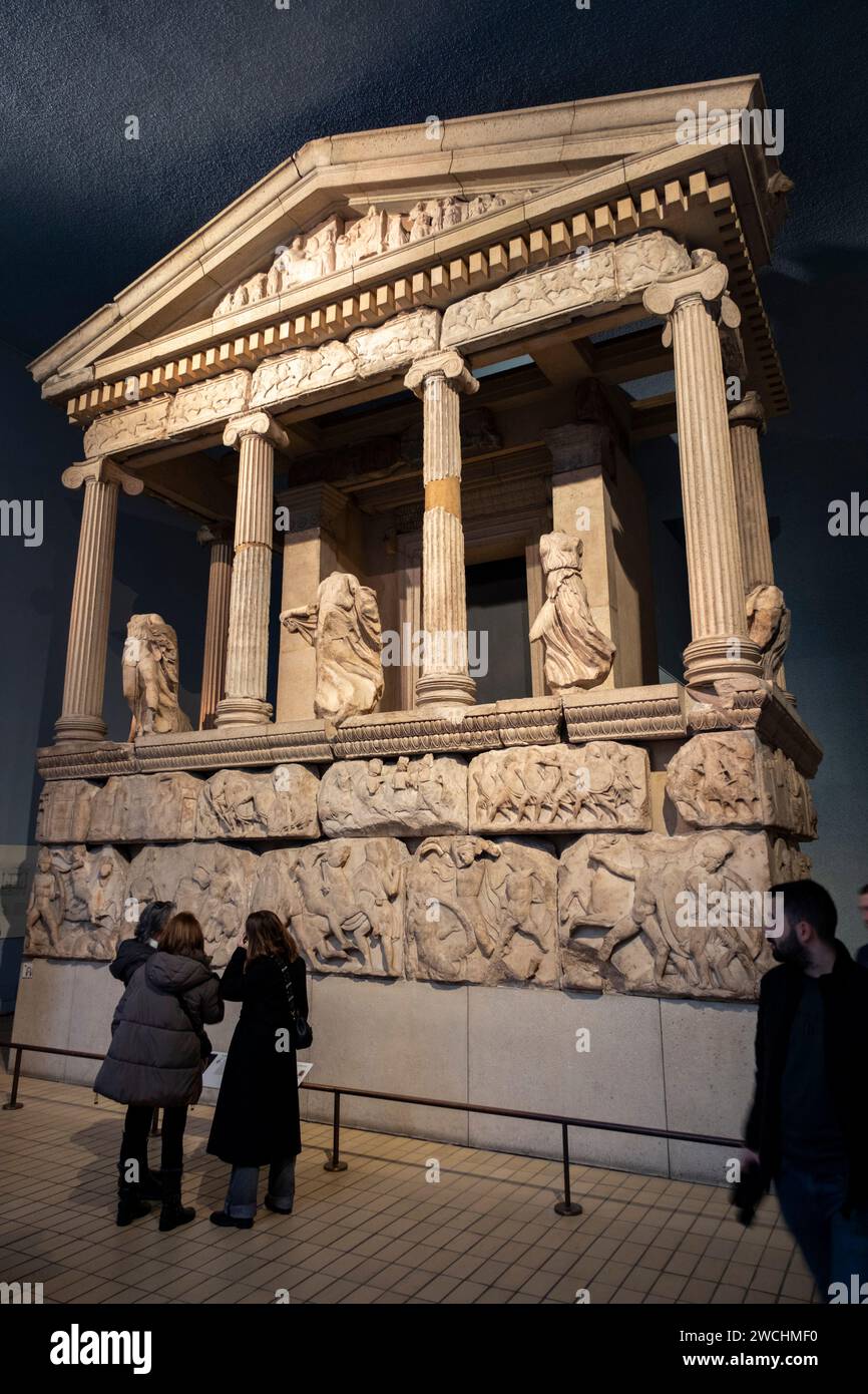 Visitors enjoy Greek and Roman artifacts at the British Museum including the Nereid Monument on 4th December 2023 in London, United Kingdom. The British Museum is a public museum dedicated to human history, art and culture located in the Bloomsbury area of London. It has a permanent collection of eight million works and is among the largest and most comprehensive collection, which documents the story of human culture from its beginnings to the present. Stock Photo