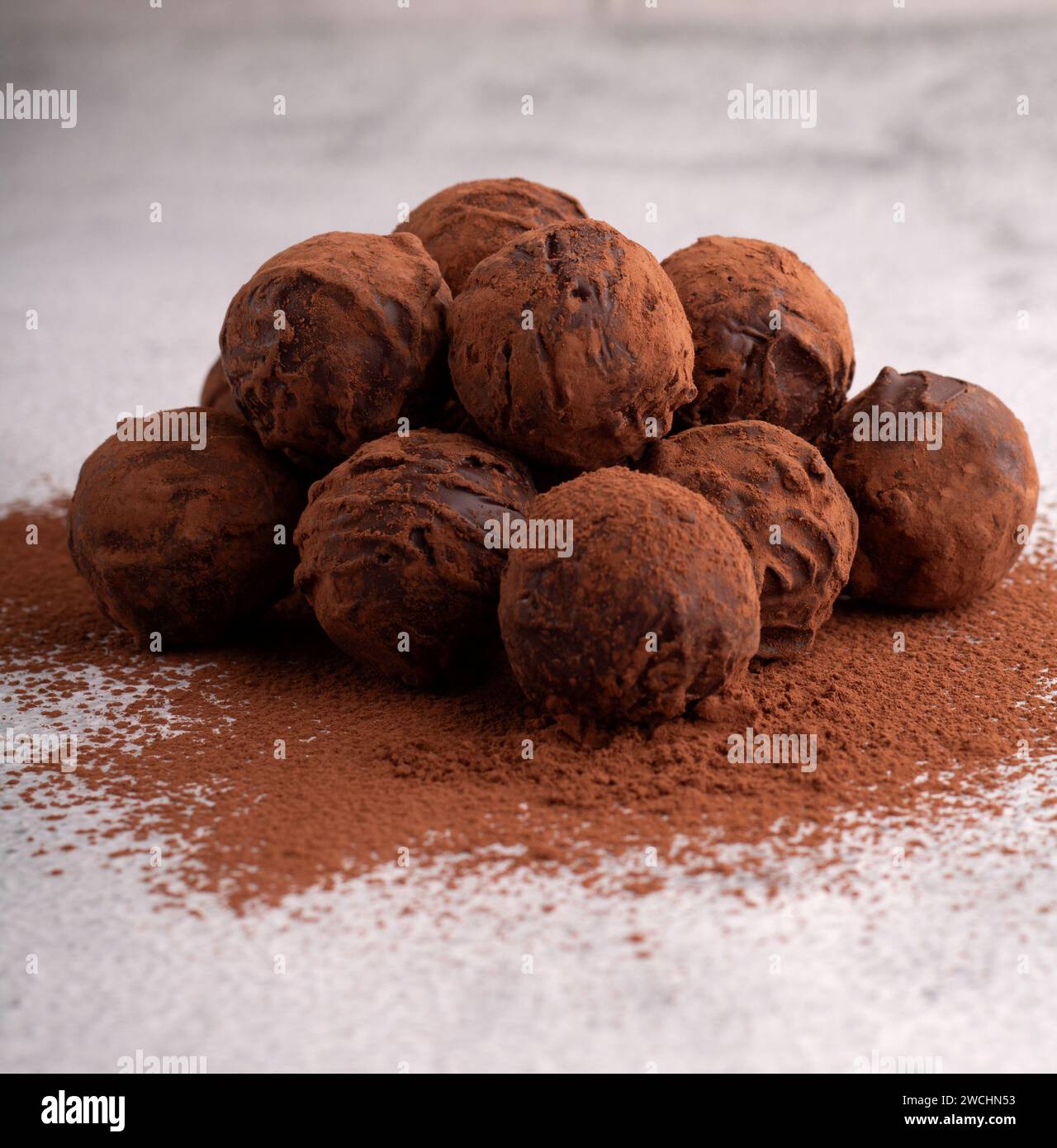 photo homemade dark chocolate truffles, a sweet and energy-packed dessert. of cocoa-coated treats, promising a rich and satisfying flavor experience. Stock Photo