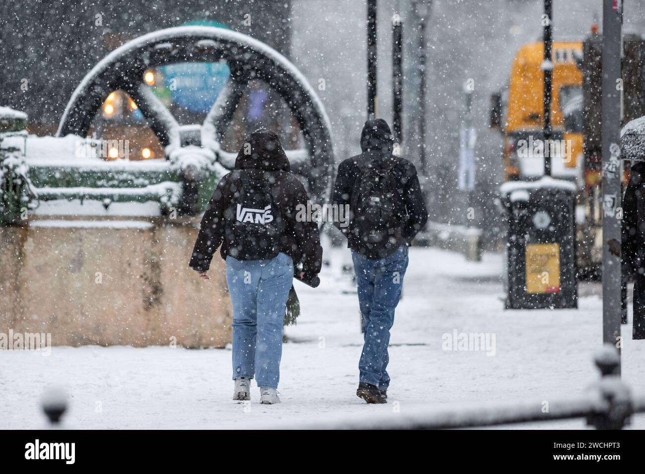 Manchester, UK. 16th Jan, 2024. Commuters battle with the conditions
