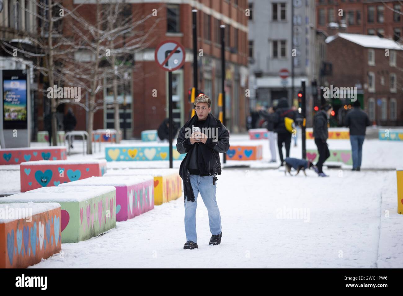 Manchester, UK. 16th Jan, 2024. A man films the weather at Stevenson's