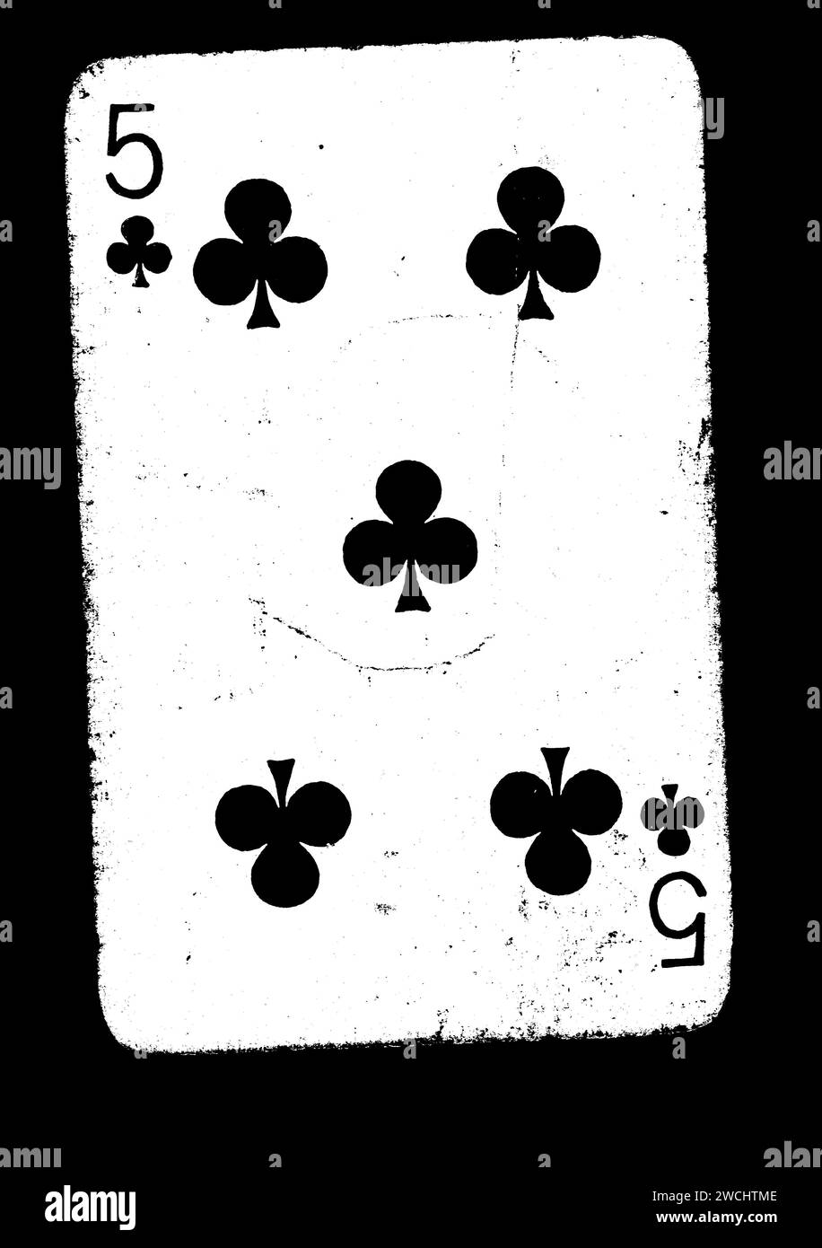 A vintage five of clubs playing card  isolated on a black background. Stock Photo