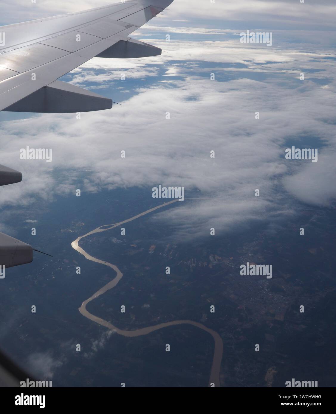 Reflection from a meandering river in Vietnam. View from a commercial ...