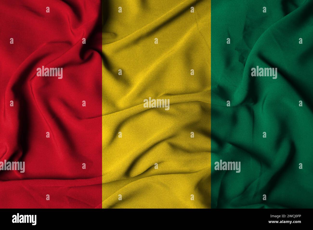 Selective focus of guinea flag, with waving fabric texture. 3d illustration Stock Photo